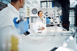 Science, collaboration and scientists working in a laboratory for medical research or analysis together. Biotechnology