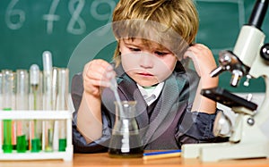 Science concept. Gifted child and wunderkind. Kid study chemistry school. School education. Explore biological molecules