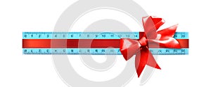 Science and education - Plastic blue school ruler gift tied red bow isolated