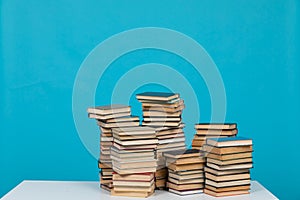 science education stack of books on a blue background teaching literacy