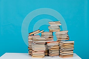 science education stack of books on a blue background teaching literacy