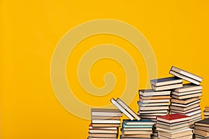 science education stack of books on a yellow background teaching literacy