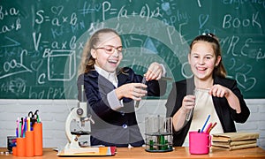 Science experiments in laboratory. Biology lab. Happy Genius. Chemistry research in laboratory. Little girls scientist