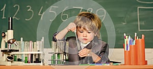 science experiments with microscope in lab. biology. Little boy is making science experiments. little boy at lesson