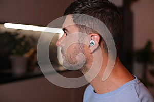 Science fiction style concept where a man has an eyeball inside his ear