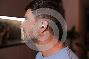 Science fiction style concept where a man has an eyeball inside his ear
