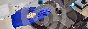 Science lab research safe of new drugs, microscope and pills coronavirus BANNER, LONG FORMAT