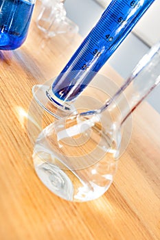 Science laboratory beaker made in glass on the table