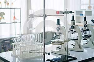 Science laboratory, Microscope and test tubes on the working table chemistry laboratory, scientist test tube with samples