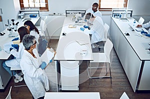Science, laboratory teacher and university students working on a chemical, pharmaceutical and medical exam. Student team
