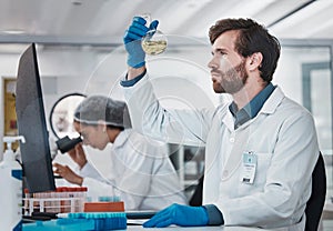 Science, man or scientist in laboratory with chemical liquid after chemistry research or scientific testing. Physics