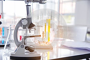 Science microscope equipment in biology chemical laboratory. Scientific experiment Microscope on Lab table microbiology equipment