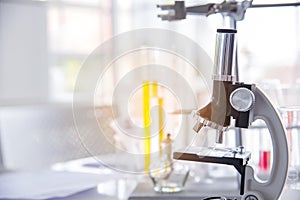 Science microscope equipment in biology chemical laboratory. Scientific experiment Microscope on Lab table microbiology equipment