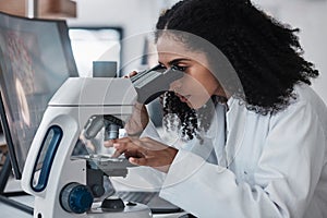 Science, microscope and slide with a doctor black woman at work in a lab for innovation or research. Medical, analysis