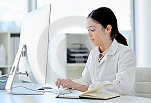 Science, notebook and woman with computer typing medical study, online report or results. Website, writing and review