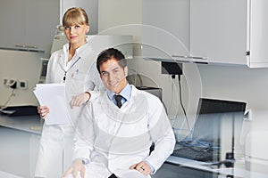 Science people in bright lab