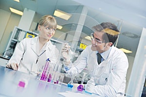 Science people in bright lab