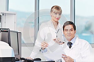 Science people in bright lab