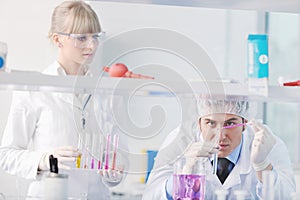 Science people in bright lab