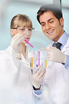 Science people in bright lab