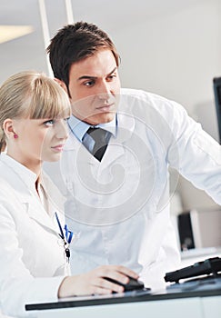 Science people in bright lab