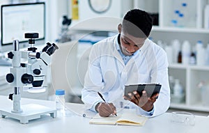 Science, researcher and black man writing, tablet and notes for experiment and test scores with connection. Laboratory