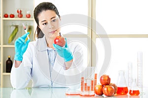 Science researcher holding up a GMO plant