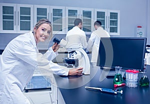 Science student working with microscope in the lab