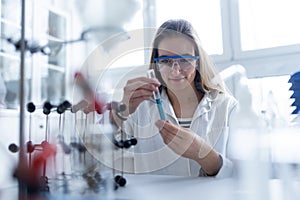 Science students doing chemical experiment in the laboratory at university.