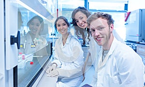 Science students using pipette in the lab