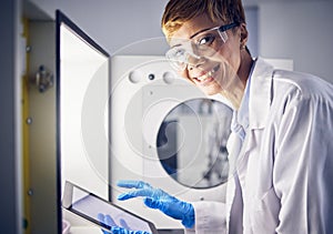 Science, tablet or lab portrait of woman with safety storage for pharmaceutical innovation, medical development or