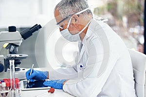 Science, tablet and scientist writing results of a vaccine in after medical exam in a lab or laboratory. Medicine