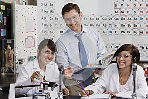 Science Teacher Assisting Student