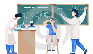 Science teacher professor standing near chalkboard teaching boy student in classroom at school