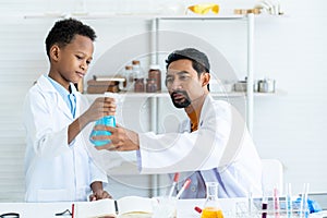 science teacher, teaching boy students, Science experiment,