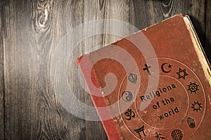 Science of world religions book on wooden table photo