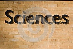 Sciences sign on a brick wall