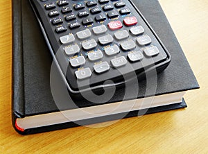 Scientific calculator on book