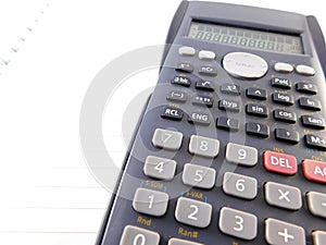 Scientific calculator and notebook.