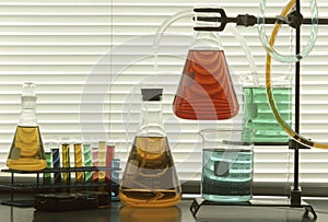 Scientific glassware with colored liquids photo