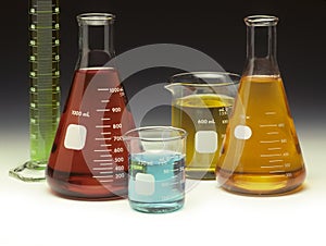 Scientific glassware filled with colored liquids