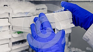 Scientific manipulating tests in bioscience laboratory freezer. Concept of science, laboratory and study of diseases. Coronavirus