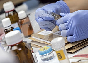 Scientific Police takes blood sample at Laboratorio forensic equipment photo