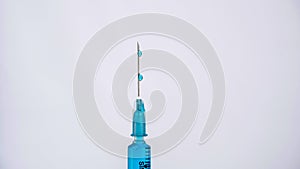 Scientific researcher or doctor using syringe and vaccine in a laboratory with white background. A doctor Filling vaccine to