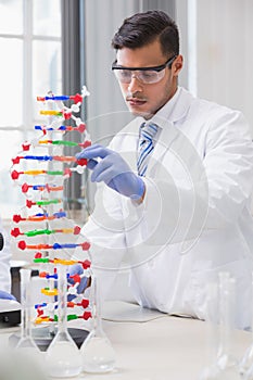 Scientist analysing dna helix