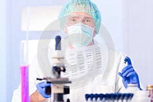 Scientist analysing DNA sequence in the lab