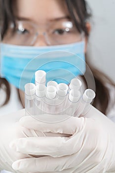 Scientist analyzing holding test tube in laboratory
