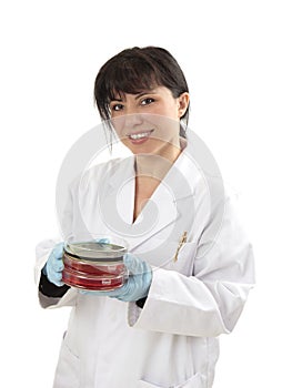 Scientist carrying petri dishes