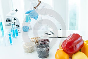 Scientist check chemical food residues in laboratory. Control experts inspect quality of fruits, vegetables. lab, hazards, ROHs,