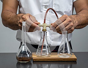 Scientist Connecting Laboratory Glassware for Experiment